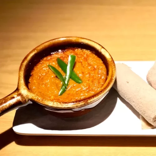 Chopped vegetables and Habesha vegetarian stew served with injera